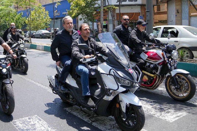 Foreign Minister Rides Motorcycle in Funeral Parade