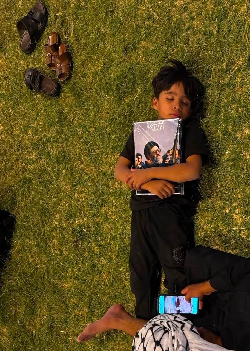 Mourners Sleep Near Portrait Awaiting Funeral Procession