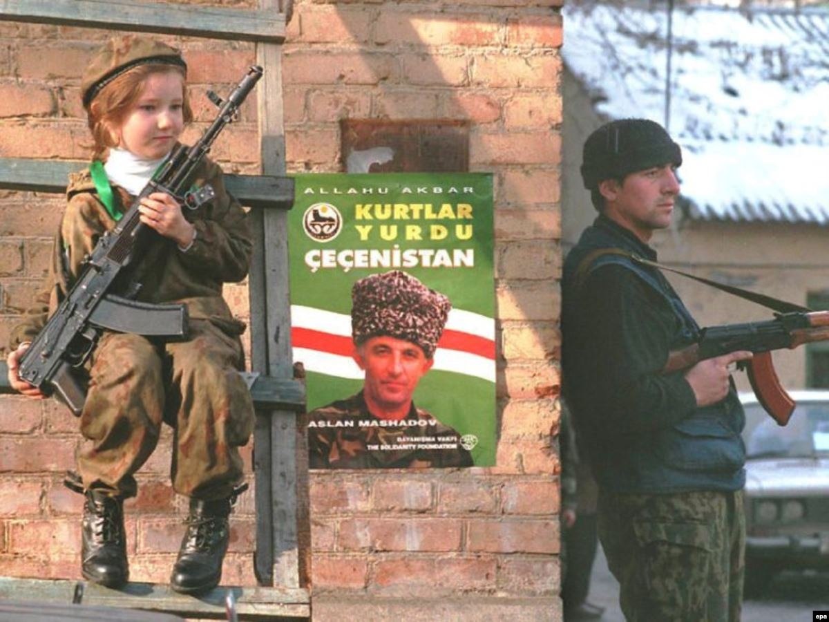 Historical Photo Shows Young Girl with AKS‑74 in Grozny, 1997