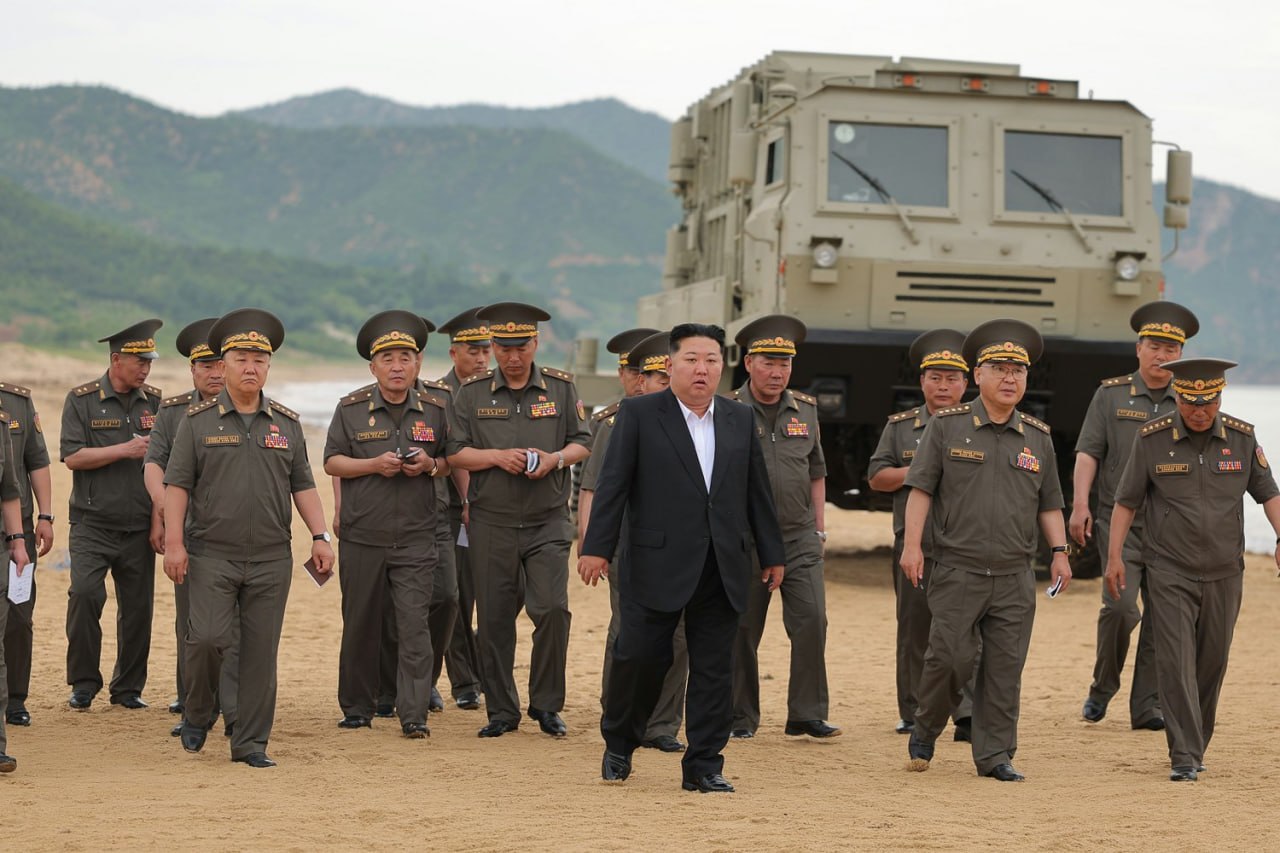 Masked Kim oversees test of 240mm rocket launcher and 155mm artillery