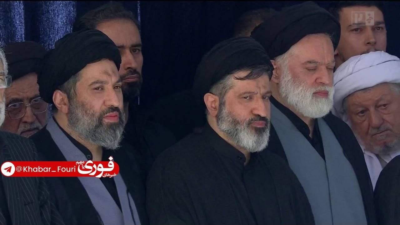 Children of Martyr Leader Line Up for Prayer on Father's Body